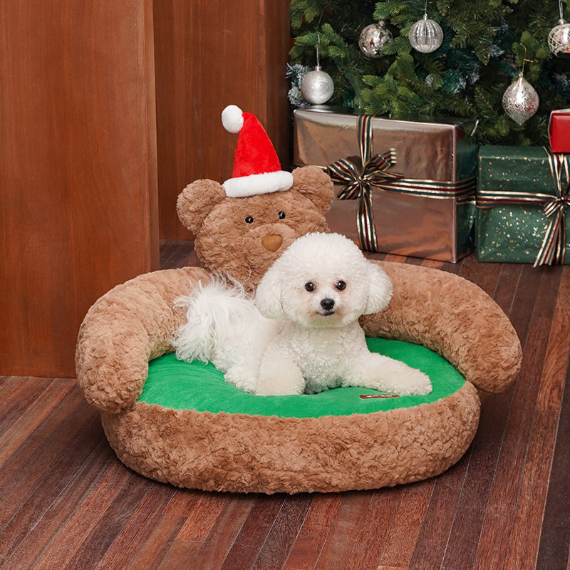 Ce banc pour animaux de compagnie avec un ours de Noël