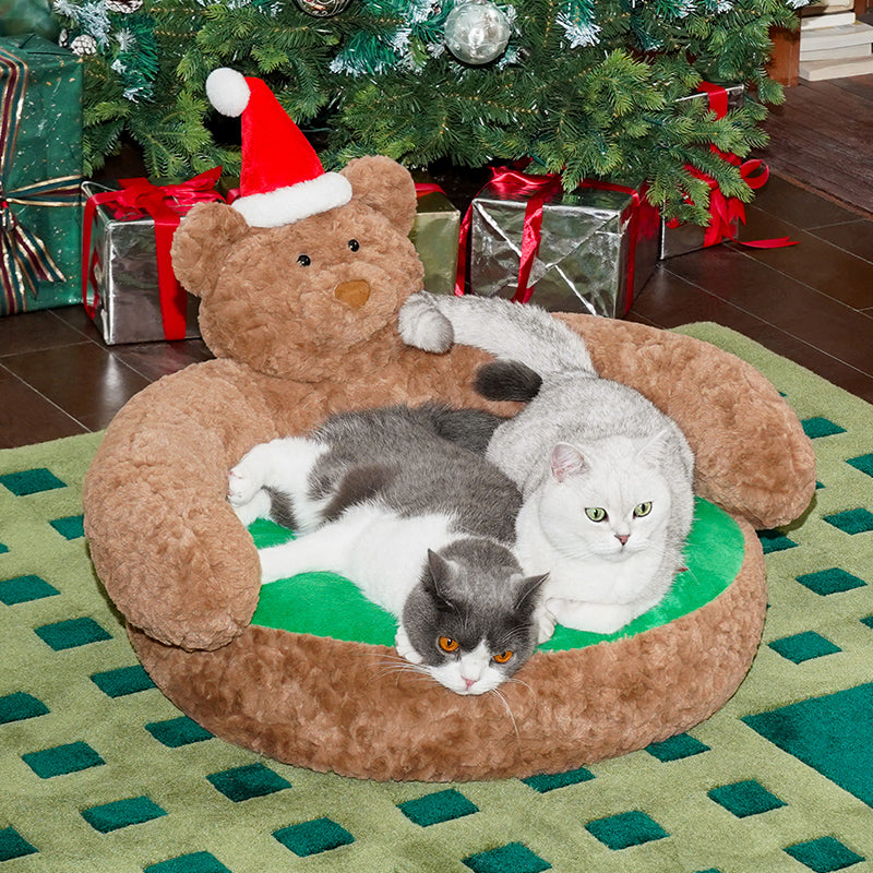 Ce banc pour animaux de compagnie avec un ours de Noël